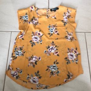 Gold and floral chiffon top.